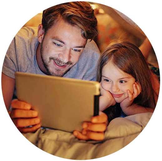 Father and daughter looking at a tablet computer